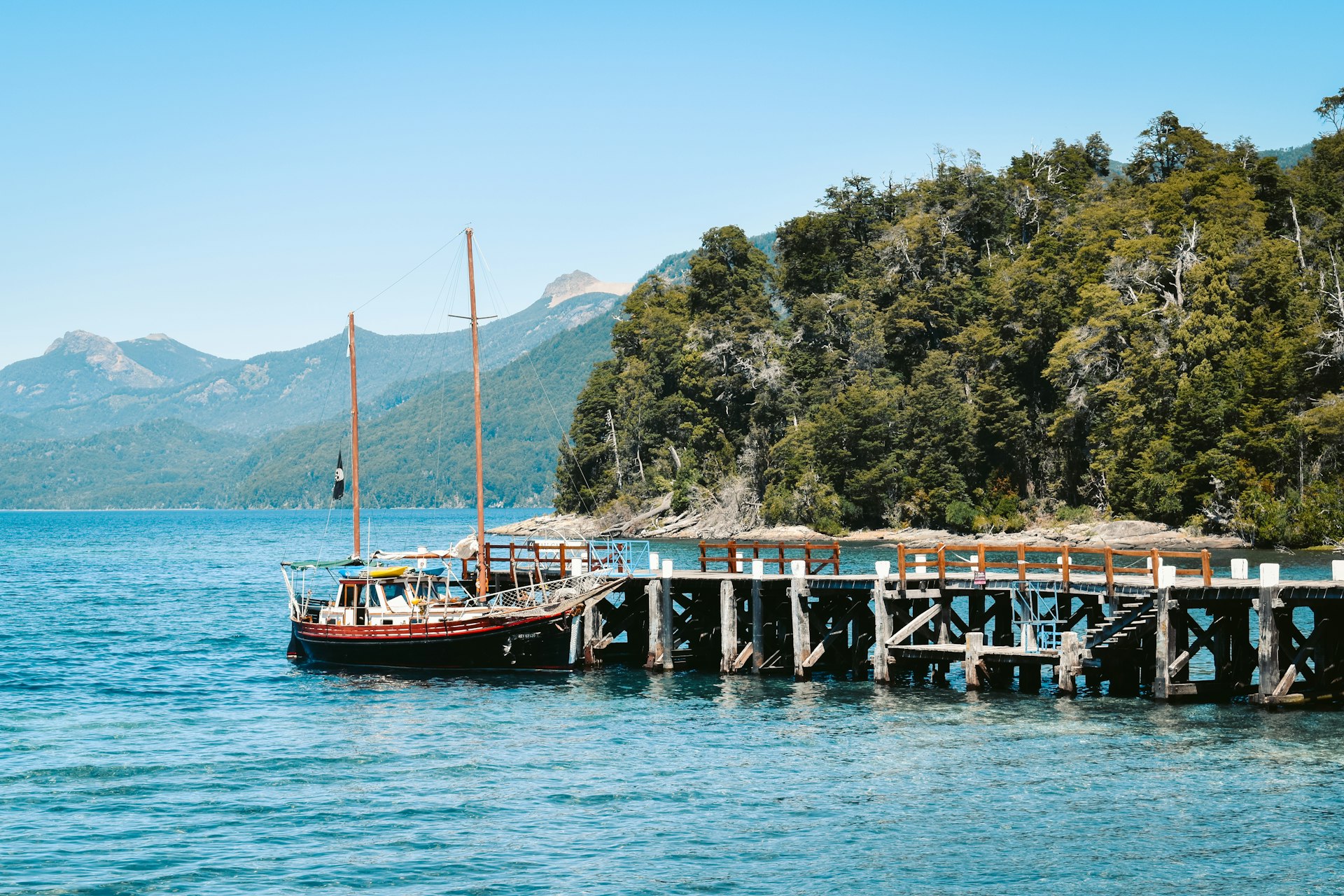 brown and white boat on body of water during daytime